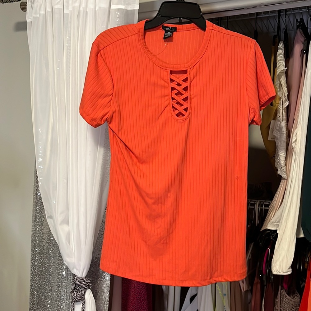 Orange stretchy shirt with cut out